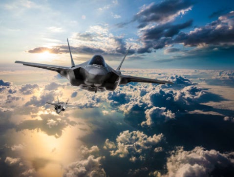 Military aircraft in flight representing aerospace and defense applications